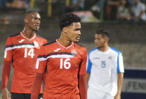 Photo: Trinidad and Tobago midfielders Alvin Jones (centre) and Hashim Arcia (left) in action against Nicaragua on 27 December 2016. (Copyright Leonel Rodriguez/TTFA Media)