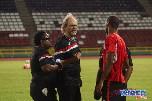 Photo: Trinidad and Tobago National Senior Team coach Tom Saintfiet (centre) and Dr Terence Babwah (left) talk to defender Carlyle Mitchell during training at the Hasely Crawford Stadium in Port of Spain on 15 December 2016. (Courtesy Nicholas Williams/Wired868)