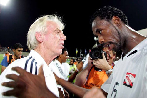 Photo: Former Trinidad and Tobago defender Dennis Lawrence (right) and coach Leo Beenhakker have a word in Manama on 17 November 2005. Lawrence scored the only goal as T&T edged Bahrain 1-0 that night to qualify for the 2006 World Cup. (Copyright Daily Post)