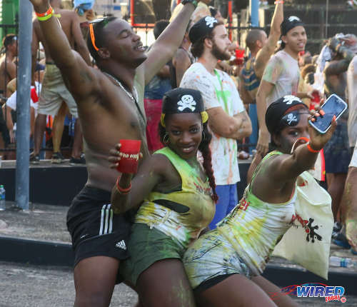 Photo: Revellers enjoy themselves during the 2016 J'Ouvert celebrations. Is the carnality encouraged by Carnival one of the country's problems? (Courtesy Sean Morrison/Wired868)