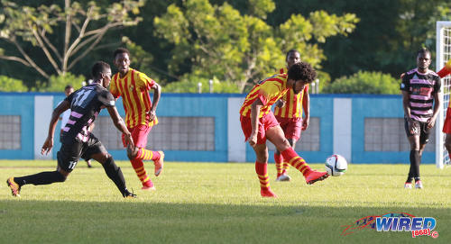 Photo: Teenaged Point Fortin Civic attacker Nion Lammy (centre) passes for a teammate during Pro League action against Ma Pau Stars at the Ato Boldon Stadium on 18 September 2016. (Courtesy Sean Morrison/Wired868)