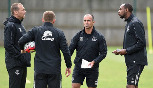 Photo: Former Everton FC manager Roberto Martinez (second from right) speaks to assistants Dennis Lawrence (far right) and Graeme Jones during a file photo.