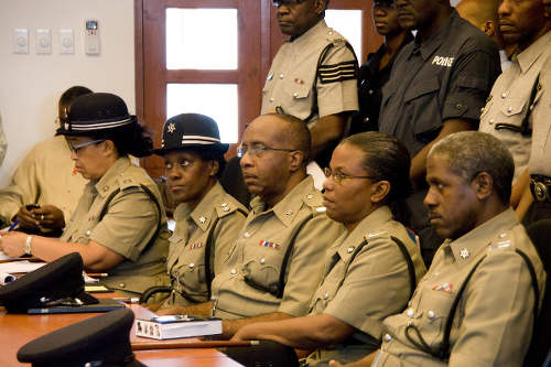 Photo: Senior members of the Trinidad and Tobago Police Service during an address by then National Security Minister John Sandy in 2010. Involved in serious discussion about protecting and serving? (Courtesy News.Gov.TT)