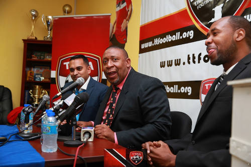 Photo: TTFA president David John-Williams (centre), media officer Shaun Fuentes (left) and new Soca Warriors coach Dennis Lawrence at the TTFA headquarters on 30 January 2017. (Copyright Allan V Crane/TTFA)