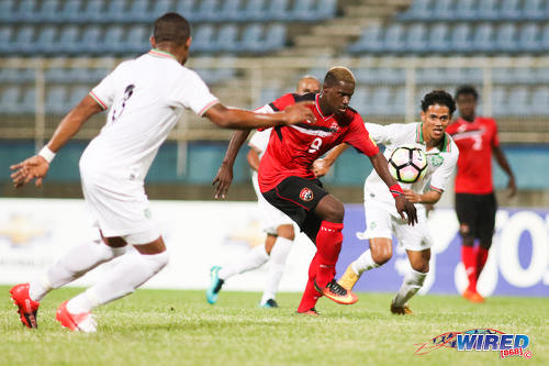 Photo: Trinidad and Tobago forward Akeem Roach (centre) tries to find a route to goal during 2017 Gold Cup playoff action at the Ato Boldon Stadium, Couva on 4 January 2017. (Courtesy Chevaughn Christopher/Wired868)