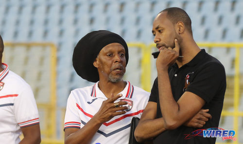 Photo: Trinidad and Tobago National Senior Team head coach Dennis Lawrence (right) chats with National Under-20 Team coach Brian Williams on Thursday 26 January 2017. (Courtesy Sean Morrison/Wired868)