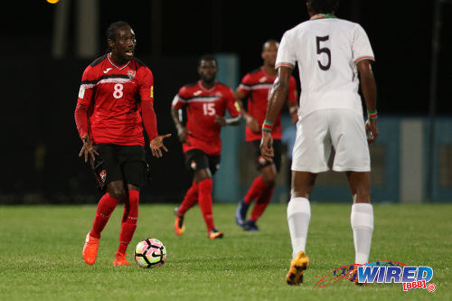 Photo: Trinidad and Tobago winger Nathan Lewis (left) looks for support during 2017 Gold Cup playoff action against Suriname at the Ato Boldon Stadium, Couva on 4 January 2017. (Courtesy Chevaughn Christopher/Wired868)