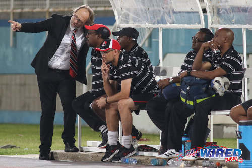 Photo: Trinidad and Tobago National Senior Team head coach Tom Saintfiet (far left) talks to assistant coach Jamaal Shabazz (second from left) during 2017 Gold Cup playoff action against Suriname at the Ato Boldon Stadium, Couva on 4 January 2017. (Courtesy Chevaughn Christopher/Wired868)