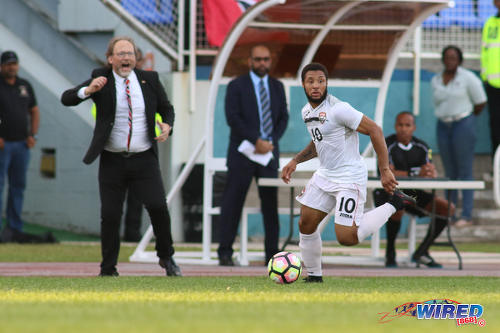 Photo: Trinidad and Tobago National Senior Team head coach Tom Saintfiet (left) cheers on hattrick hero Shahdon Winchester during 2017 Gold Cup playoff action against Haiti at the Ato Boldon Stadium in Couva on 8 January 2017. (Courtesy Chevaughn Christopher/Wired868)