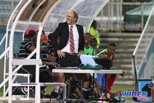 Photo: Trinidad and Tobago National Senior Team coach Tom Saintfiet shares a light moment with a member of the crowd during 2017 Gold Cup playoff action against Suriname at the Ato Boldon Stadium, Couva on 4 January 2017. (Courtesy Chevaughn Christopher/Wired868)