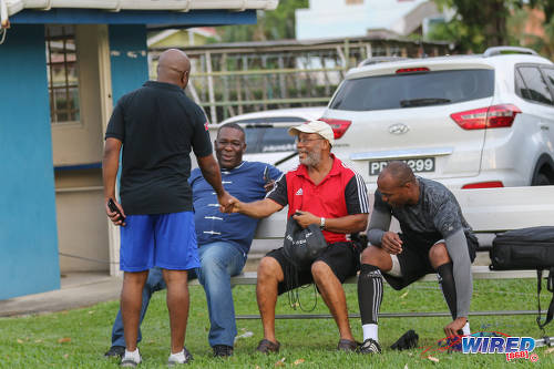 Photo: Catching up. Former Trinidad and Tobago international footballer and legendary SSFL coach Michael Grayson (centre) greets Wired868 managing director Lasana Liburd while former national youth team goalkeeper and Presentation College (San Fernando) goalkeeper coach Jefferson George (right) and ex-Soca Warriors team manager William Wallace look on at the Wired868 Football Festival V at UWI admin ground on 7 January 2017. (Courtesy Sean Morrison/Wired868)