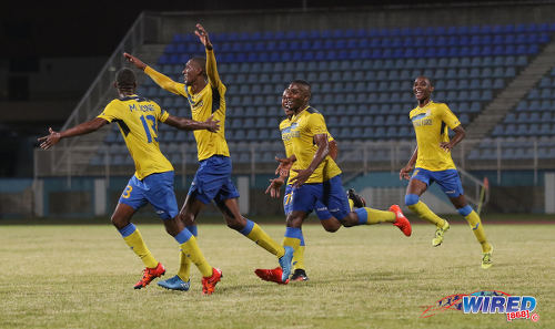 Photo: Defence Force goal scorer Hashim Arcia (second from left) celebrates with his teammates during their Pro Bowl semifinal win over Police FC at the Ato Boldon Stadium on 12 February 2017. Defence Force won 4-0. (Courtesy Sean Morrison/Wired868)