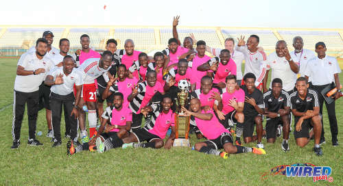 Photo: Central FC players and technical staff celebrate their third successive Pro League title at the Ato Boldon Stadium in Couva, after edging San Juan Jabloteh 1-0 on 5 February 2017. (Courtesy Sean Morrison/Wired868)