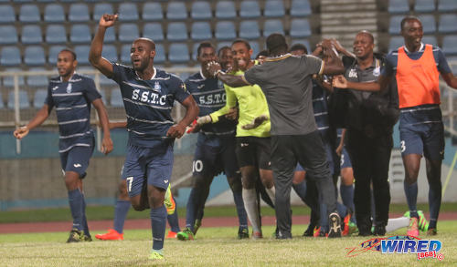 Photo: Police FC defender Dexter Alleyne (second from left) punches the air while his teammates congratulate goalkeeper Adrian Foncette (centre) after their penalty shootout win over W Connection in Digicel Pro Bowl quarterfinal action at the Ato Boldon Stadium in Couva on 8 February 2017. (Courtesy Sean Morrison/Wired868)