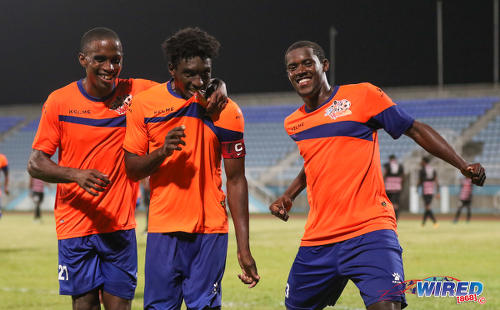 Photo: Club Sando players (from left) Jayson Joseph, Akeem Humphrey and Akeem Roach celebrate during their 2-0 Digicel Pro Bowl quarterfinal win over Ma Pau Stars at the Ato Boldon Stadium in Couva on 9 February 2017. (Courtesy Sean Morrison/Wired868)