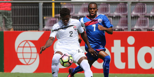 Photo: Trinidad and Tobago National Under-20 Team right back Isaiah Garcia (left) tries to keep the ball away from Bermuda National Under-20 striker Oneko Lowe during 2017 World Cup qualifying action at the Estadio Ricardo Saprissa on 19 February 2017. (Copyright Victor Straffon/Straffon Images)