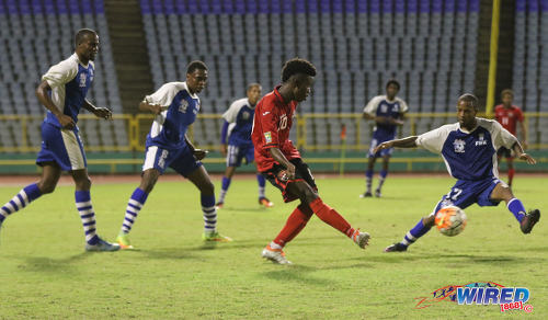 Photo: Trinidad and Tobago Under-20 Team midfielder and captain Jabari Mitchell (centre) passes the ball during a practice game against St Ann's Rangers at the Hasely Crawford Stadium in Port of Spain. (Courtesy Sean Morrison/Wired868)