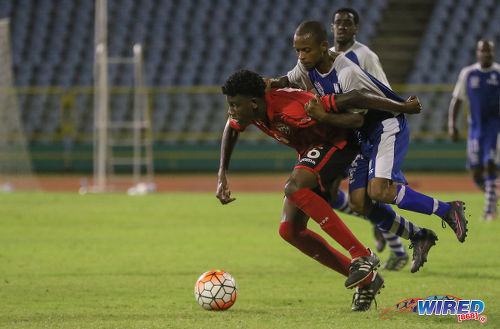 Photo: Trinidad and Tobago National Under-20 Team midfielder Joshua Sitney (left) tries to shrug off the attentions of a St Ann's Rangers player during a practice game at the Hasely Crawford Stadium in Port of Spain. (Courtesy Sean Morrison/Wired868)