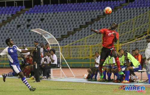 Photo: Trinidad and Tobago National Under-20 Team defender Kierron Mason (right) keeps his eye on the ball during a practice game with St Ann's Rangers at the Hasely Crawford Stadium in Port of Spain. (Courtesy Sean Morrison/Wired868)