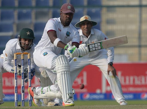 Photo: West Indies batsman Darren Bravo (centre) prepares to play a shot on the second day of the second Test between Pakistan and West Indies at the Sheikh Zayed Cricket Stadium in Abu Dhabi on 22 October 2016. (Copyright AFP 2017/Aamir Qureshi)