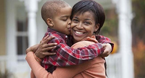 Photo: A mother is kissed by her son. (Copyright Warya Post)