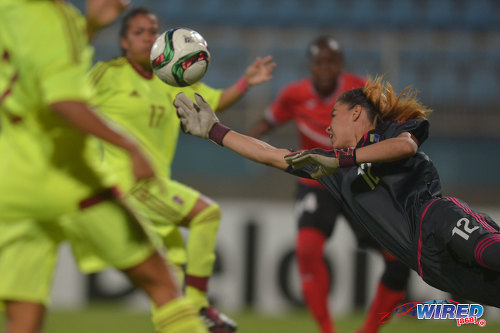 Photo: Venezuela custodian Micheel Rengifo (right) stretches for the ball during international friendly action against Venezuela at the Ato Boldon Stadium in Couva on 29 March 2017. Venezuela won 3-1. (Courtesy Chevaughn Christopher/Wired868)