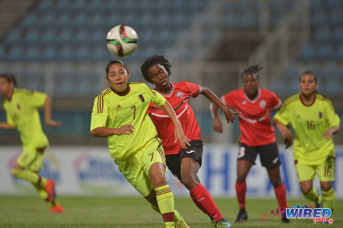 Photo: Venezuela midfielder Milagros Mendoza (foreground) looks to initiate an attack while Trinidad and Tobago midfielder Ranae Ward (centre) stays close during international friendly action at the Ato Boldon Stadium in Couva on 29 March 2017. Venezuela won 3-1. (Courtesy Chevaughn Christopher/Wired868)