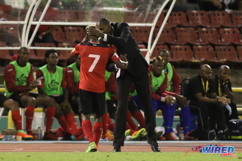 Photo: Trinidad and Tobago National Senior Team head coach Dennis Lawrence (right) thanks midfielder Cordell Cato for his effort during 2018 World Cup qualifying action against Panama at the Hasely Crawford Stadium on 24 March 2017. (Courtesy Chevaughn Christopher/Wired868)