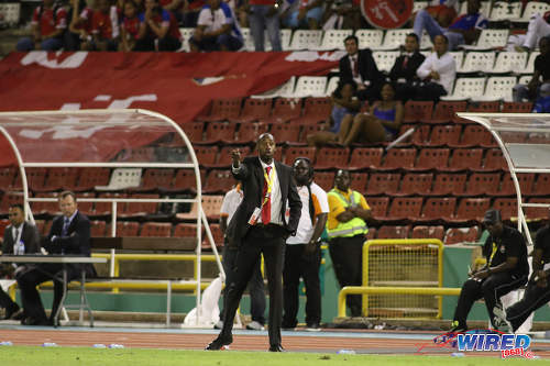 Photo: Trinidad and Tobago National Senior Team coach Dennis Lawrence (centre) makes a point to his players during World Cup qualifying action against Panama at the Hasely Crawford Stadium on 24 March 2017. (Courtesy Chevaughn Christopher/Wired868)