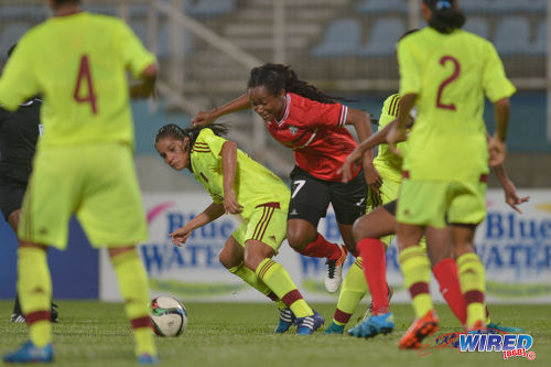 Photo: Trinidad and Tobago playmaker Dernelle Mascall (centre) drives towards the Venezuela goal during international friendly action at the Ato Boldon Stadium in Couva on 29 March 2017. Venezuela won 3-1. (Courtesy Chevaughn Christopher/Wired868)