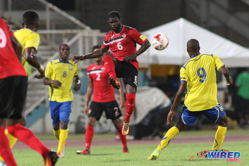 Photo: Trinidad and Tobago midfielder Hughtun Hector (centre) executes a volleyed pass during international friendly action against Barbados at the Ato Boldon Stadium in Couva on 10 March 2017. (Courtesy Chevaughn Christopher/Wired868)