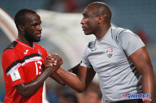 Photo: Trinidad and Tobago assistant coach Sol Campbell (right) congratulates striker Jamille Boatswain after his double strike against Barbados in a 2-0 win at the Ato Boldon Stadium on 10 March 2017. (Courtesy CA Images/Wired868)