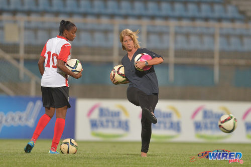 Photo: Trinidad and Tobago Women's National Senior Team head coach Carolina Morace (right) and captain Tasha St Louis warm up before kick off against Venezuela in international friendly action at the Ato Boldon Stadium in Couva on 29 March 2017. (Courtesy Chevaughn Christopher/Wired868)