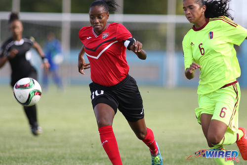 Photo: Trinidad and Tobago Women's National Senior Team attacker and captain Tasha St Louis (left) takes on Venezuela defender Rafanny Mendoza during international friendly action at the Ato Boldon Stadium in Couva on 26 May 2017. (Courtesy Chevaughn Christopher/Wired868)