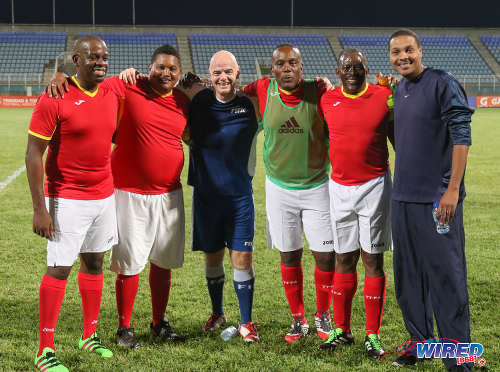 Photo: FIFA president Gianni Infantino (centre) poses with Sport Minister Darryl Smith (second from left), National Security Minister Edmund Dillon (second from right) and Speaker of the House Esmond Forde (third from right) after an exhibition match at the Ato Boldon Stadium in Couva on 10 April 2017. (Courtesy Sean Morrison/Wired868)