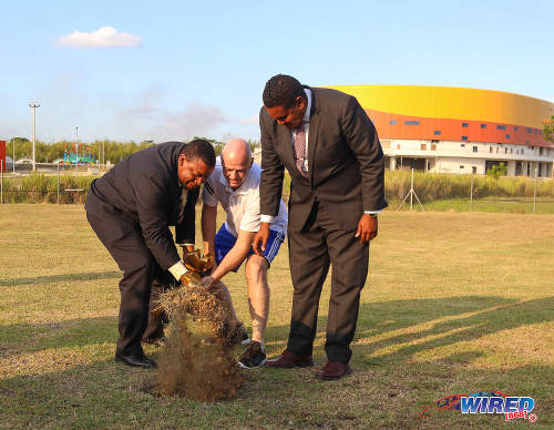 Photo: FIFA president Gianni Infantino (centre) and TTFA president David John-Williams (left) turn the sod at the Ato Boldon Stadium in Couva while Sport Minister Darryl Smith pretends to help on 10 April 2017. (Courtesy Sean Morrison/Wired868)