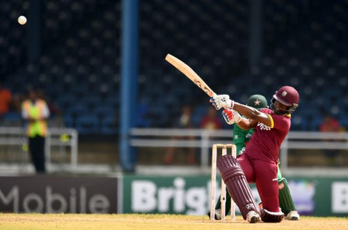 Photo: West Indies' Evin Lewis hits a boundary during the third of four T20I matches against Pakistan at the Queen’s Park Oval in Port of Spain, Trinidad, on 1 April 2017.  (Copyright AFP 2017/Jewel Samad)