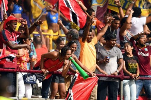 Photo: West Indies' fans cheer during the third of four T20I matches between West Indies and Pakistan at the Queen’s Park Oval in Port of Spain, Trinidad, on 1 April 2017. West Indies won the match by 7 wickets, although Pakistan eventually won the series 3-1. (Copyright AFP 2017/Jewel Samad)