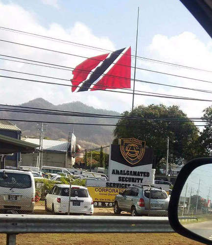 Photo: The Trinidad and Tobago flag flies half-mast at the Amalgamated Security compound in Tunapuna on 8 May 2017. Or did it? Muahahahaha...