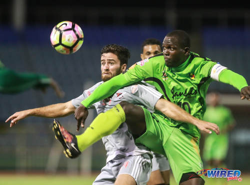 Photo: Grenades FC captain and midfielder Rakeem Henry (right) battles with Central FC midfielder Graham Smith during 2017 Caribbean Club Championship action at the Hasely Crawford Stadium on 14 May 2017. Smith, a United States citizen, is on a three-week contract for Central and has never played a Pro League match. (Courtesy Nicholas Bhajan/Wired868)