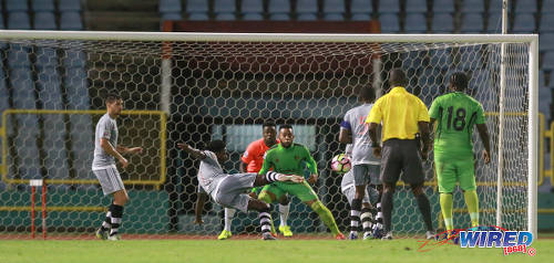 Photo: Central FC attacker Jason Marcano (centre) lashes home a stylish equaliser during 2017 Caribbean Club Championship action against Grenades FC at the Hasely Crawford Stadium on 14 May 2017. Central went on to win 3-1. (Courtesy Nicholas Bhajan/Wired868)