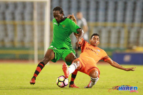 Photo: San Juan Jabloteh winger Nathan Lewis (left) terrorises Cibao FC right back Ernesto Trinidad during the Caribbean Club Championship final on 21 May 2017 at the Hasely Crawford Stadium in Port of Spain. Cibao won 1-0. (Courtesy Allan V Crane/Wired868)