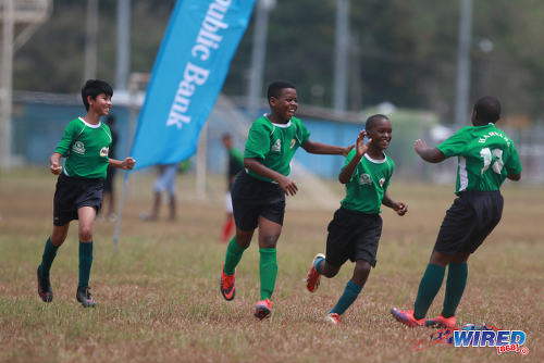 Photo: Harvard SC players celebrate a divisive goal during RBNYL Under-13 action against Eastern United at the Queen's Park Savannah on 15 May 2017. (Courtesy Nicholas Bhajan/Wired868)