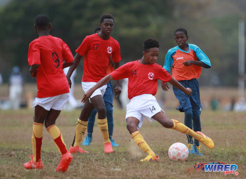 Photo: Trendsetter Hawks Under-15 attacker Josiah Edwards (second from right) takes a crack at goal during RBNYL action against Laventille United at the Queen's Park Savannah on 15 May 2017. Edwards, who is a National Under-15 player, treated himself to a few goals as Hawks won 11-1. (Courtesy Nicholas Bhajan/Wired868)