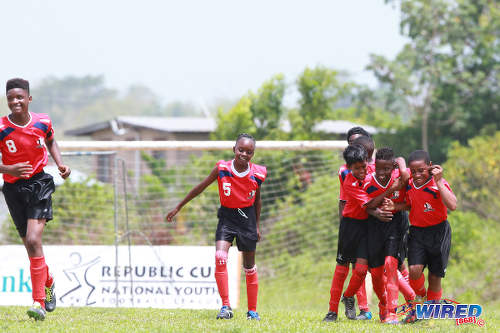 Photo: Petrotrin Palo Seco players celebrate a goal against Giving Back during RBNYL Under-13 action in La Brea on 21 May 2017. (Courtesy Allan V Crane/Wired868)