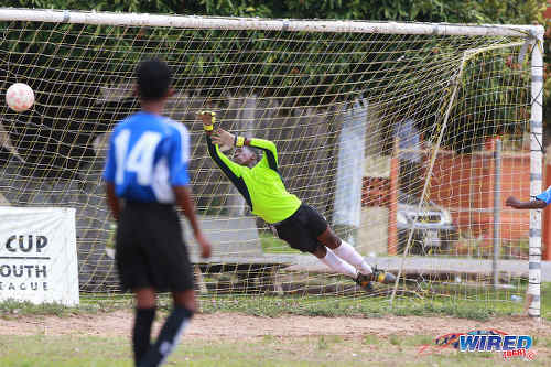 Photo: Club Sando's Under-13 goalkeeper makes a vain attempt to reach a shot during RBNYL action against Petrotrin Palo Seco SA in La Brea on 21 May 2017. Palo Seco won 2-0. (Courtesy Allan V Crane/Wired868)