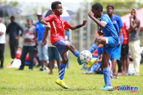 Photo: Ste Madeleine Strikers player Malique King (right) and San Fernando SA player Asime Walker contest the ball during RBNYL action in La Brea on 21 May 2017. (Courtesy Allan V Crane/Wired868)