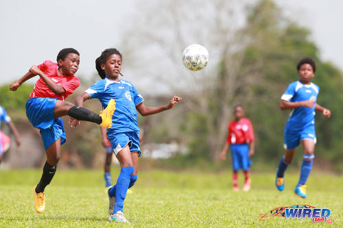 Photo: Ste Madeleine playmaker Aklilu Joseph (centre) tries to close down an attempt by a San Fernando SA player during RBNYL action in La Brea on 21 May 2017. (Courtesy Allan V Crane/Wired868)