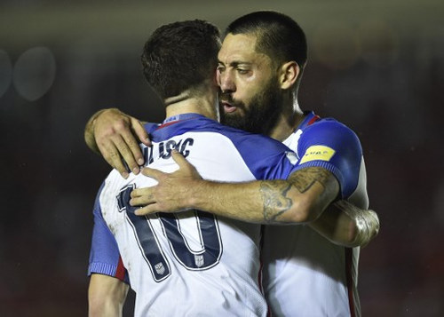 Photo: USA forward Clint Dempsey (right) celebrates with teammate Christian Pulisic after scoring against Panama during their 1-1 draw in 2018 World Cup qualifying action in Panama City on 28 March 2017. (Copyright AFP 2017/Rodrigo Arangua)